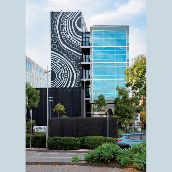 View of the hospital featuring <strong>Together</strong> (2021), by Elizabeth Close (Pitjantjatjara and Yankunytjatjara) and Samantha Roberts (Wurundjeri and Dja Dja Wurrung), acrylic paint, 20.0 × 7.2 m. Commissioned by the Royal Children’s Hospital Foundation. Photograph
  by Alvin J Aquino. Royal Children’s Hospital Communications